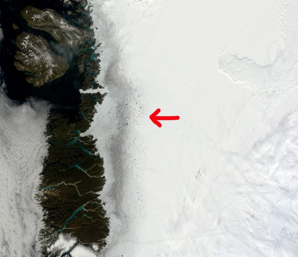 Satellite images of the dark zone of Greenland ice sheet clearly show the impure ice in remarkable contrast to the pristine snow. Satellites however miss out on details in the composition of the impurities. Credit MODIS/NASA