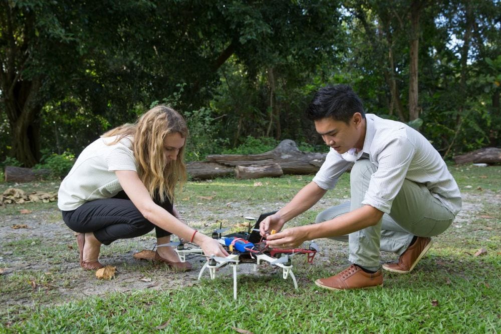 Fornace and colleague prepare drone for monkey malaria project