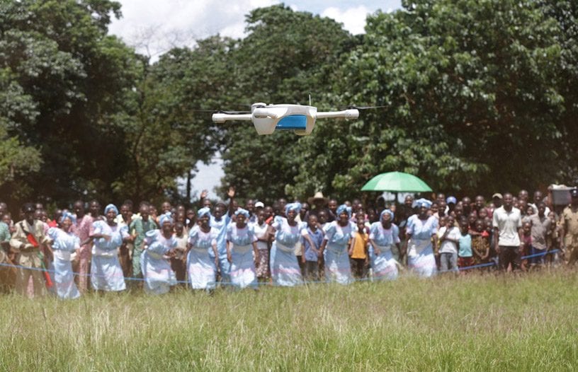 Children look on as the United Nations Children’s Fund and the Government of Malawi test the use of unmanned aerial vehicles to reduce waiting times for infant HIV tests. Credit: UNICEF/Khonje