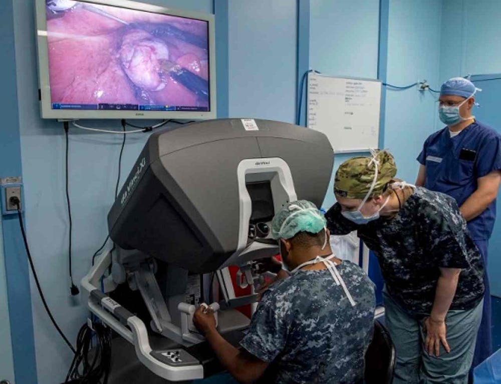 Doctors confer during the first robot-assisted surgery aboard the hospital ship USNS Mercy. Kelsey L. Adams/U.S. Navy