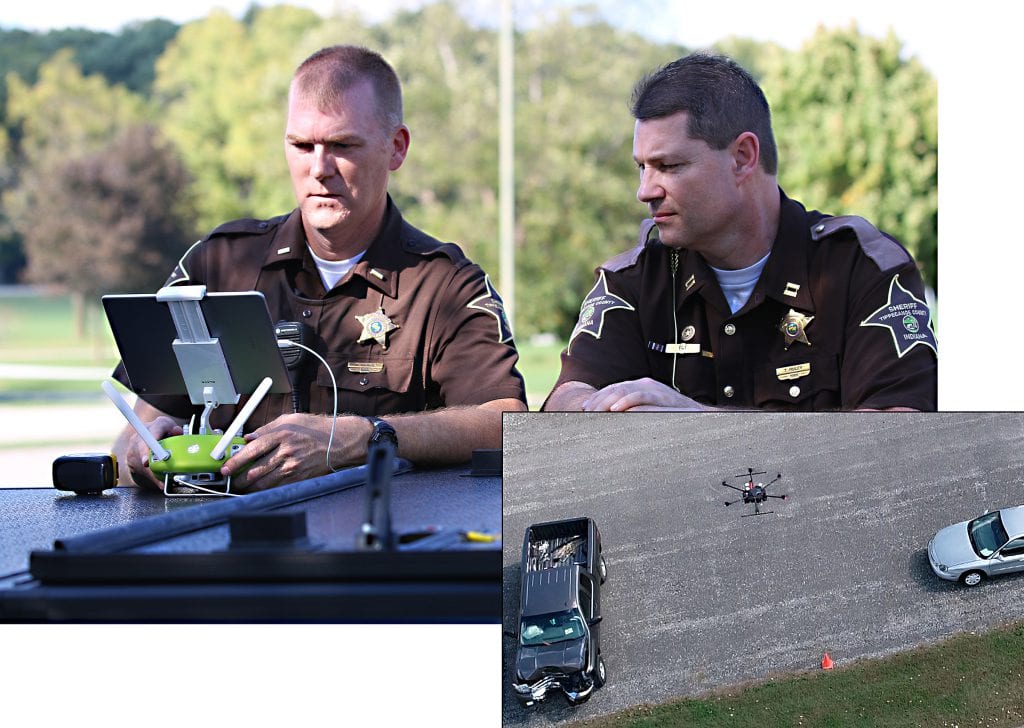 Capt. Rob. Hainje and Capt. Terry Ruley of the Tippecanoe County Sheriff’s Office test drone technology for use at vehicular crash sites. The office used the technology to map vehicular crash scenes 20 times in 2018. (John Bullock and Erin Easterling/Purdue University)