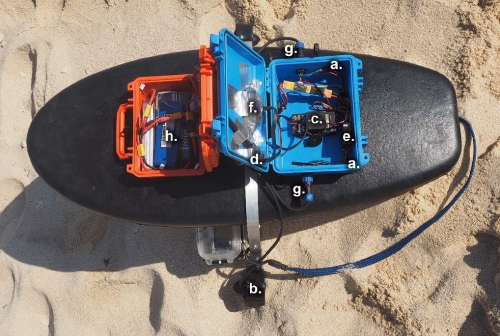 Fully assembled Reef Rover Version 2. The control unit is housed in the blue case and contains the autopilot, electronic speed controllers, radios, and Global Positioning System (GPS). The orange case contains the LiPo batteries that provide power to the control unit and electric motors. The following components are labelled in the lower image and detailed further in Table 1. (a) Blue Robotics electronic speed controllers (ESCs), (b) Blue Robotics T100 thrusters, (c) Pixhawk 1 flight controller, (d) Telemetry radio, (e) Radio and receiver for communicating with the remote controller (f) Ublox M8N GPS, (g) Waterproof panel plugs, and (h) 3 cell (11.1 volt), 5000 mAh LiPo batteries.