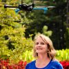 This is Mary 'Missy' Cummings standing with a hovering drone in the Sarah P. Duke Gardens at Duke University, where she will work to generate a set of inexpensive, unobtrusive best practices to deter unwanted drone usage.