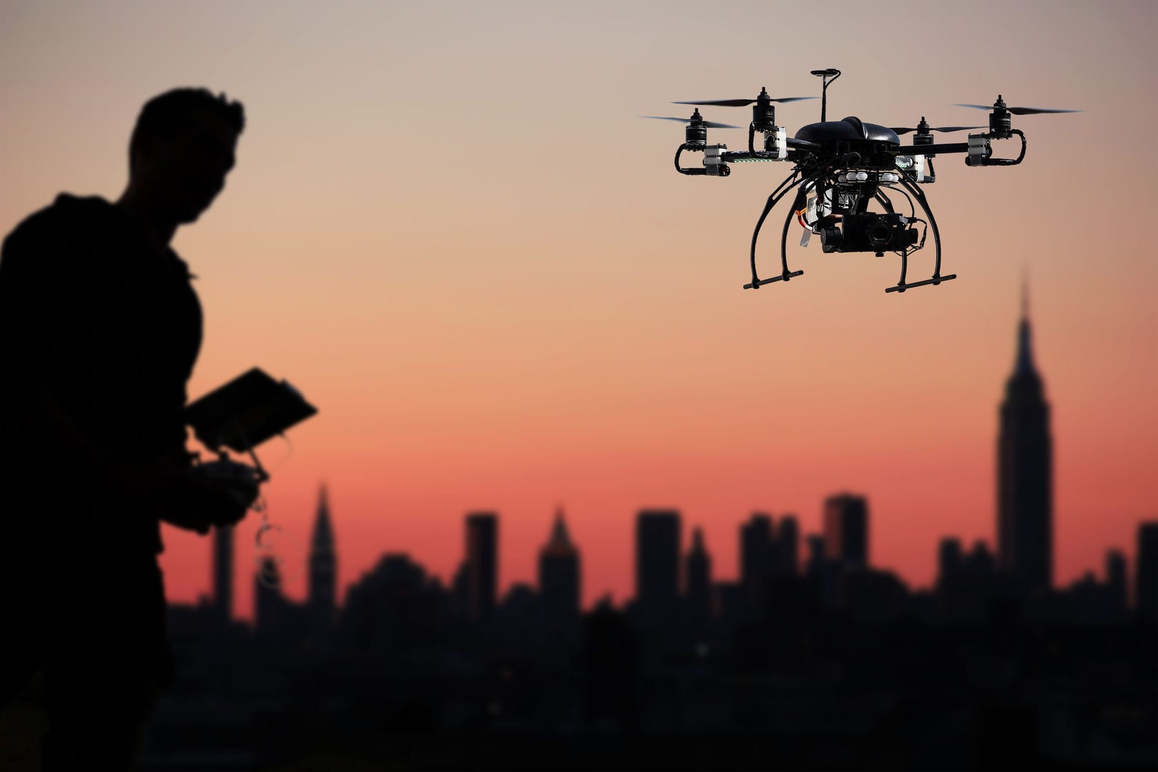 Journalist flying drone over city