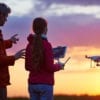 Man and Daughter Flying Drone