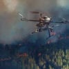 A small UAV is shown surveying the movement of a forest fire. The EOAMS would allow first responders to deploy drones at disaster scenes without endangering other emergency response aircraft or commercial flights. [photo illustration by Kongsberg Geospatial