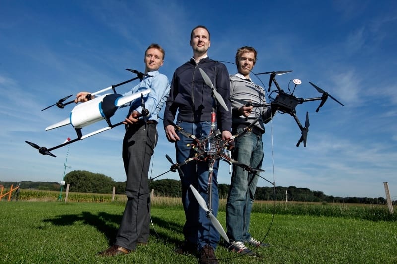 Theys, left, with some self-made drones created with colleagues at the University of Leuven | DIY Drones