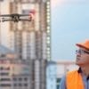 A drone helps a woman at work