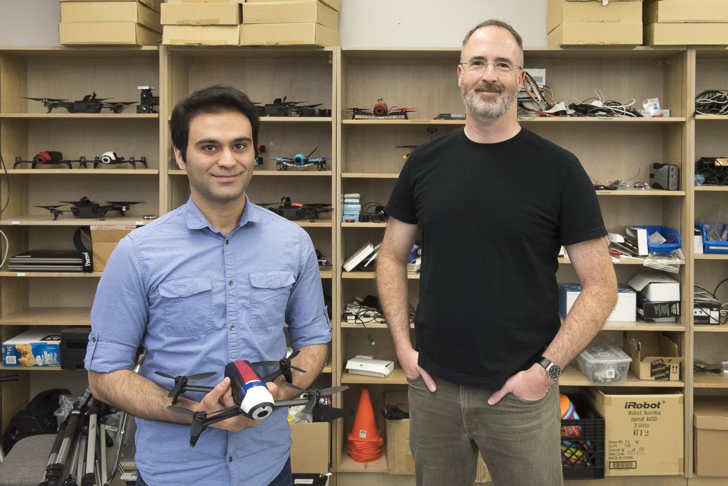 Computing science professor Richard Vaughan (right) and Ph.D. student Sepehr MohaimenianPour (left) are developing technologies in SFU's Autonomy Lab to help users interact with drones in a more intuitive manner.