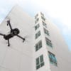 A drone flies near a building