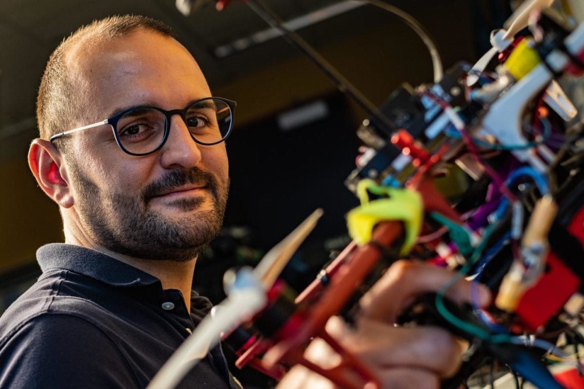 Rice University postdoctoral researcher Riccardo Petrolo shows one of several autonomous aerial drones being prepared to monitor for pollutants.