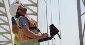 Experts from Michael Baker International using the Intel Falcon 8+ drone to aid in the inspection of the Daniel Carter Beard Bridge, which connects Ohio and Kentucky. In partnership with the Kentucky Transportation Cabinet and Michael Baker International, Intel used its drone technology to help inspect and analyze the eight-lane interstate bridge across the Ohio River. (Credit: Intel Corporation)