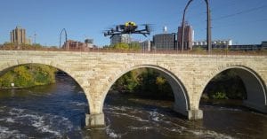 The Intel Falcon 8+ drone conducts a visual inspection of the historic Stone Arch Bridge in Minneapolis. Working with the Minnesota Department of Transportation and Collins Engineers, Intel used its commercial drone technology to help automate and expedite inspection of the pedestrian and bicycle bridge. (Credit: Intel Corporation)