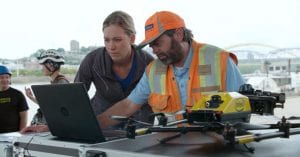 Alicia McConnell and Brian Gutzwiller from Michael Baker International plan the automated missions to inspect the Daniel Carter Beard Bridge. In partnership with the Kentucky Transportation Cabinet and Michael Baker International, Intel used its drone technology to help inspect and analyze the Daniel Carter Beard Bridge, an eight-lane interstate across the Ohio River. (Credit: Intel Corporation)